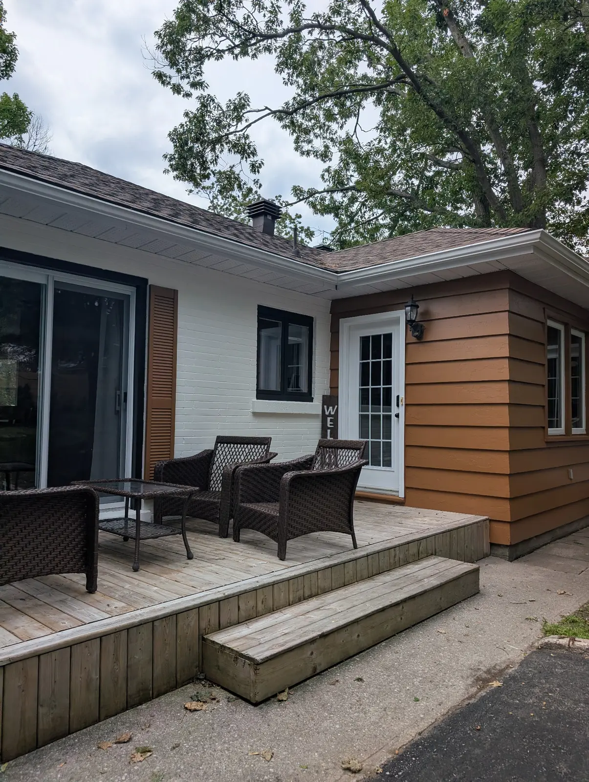 Completed exterior painting in Letitia Heights, Barrie, showing painted brick, window trim, siding, posts, and shutters